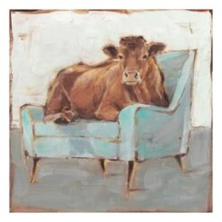 Cow Sitting On Blue Chair Canvas Wall Art, 22"